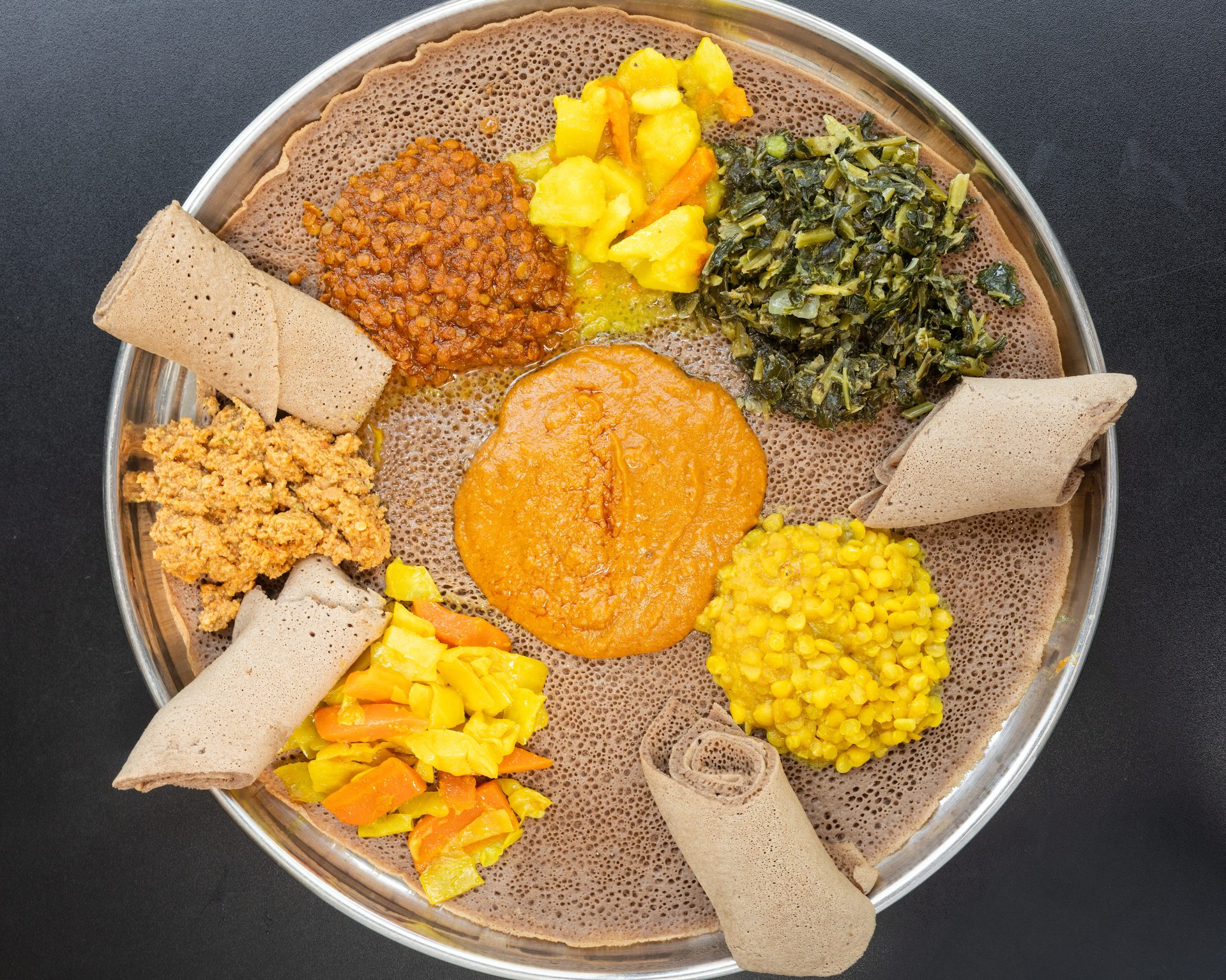 Tear the Injera. Eat Together.